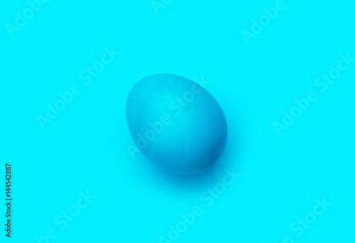 blue easter egg, isolated on blue background.