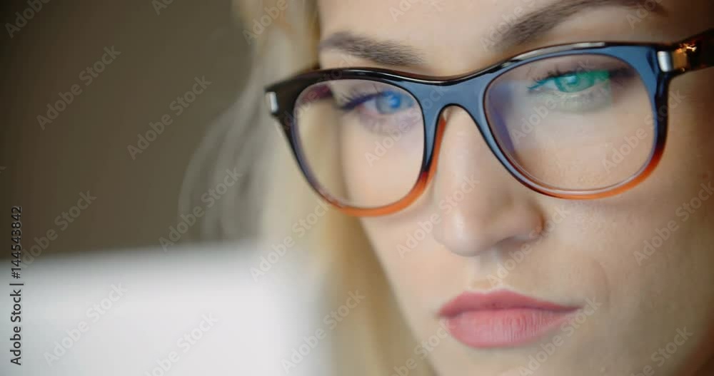 Businesswoman Wearing Eyeglasses in office. Businesswoman Wearing Eyeglasses in office.