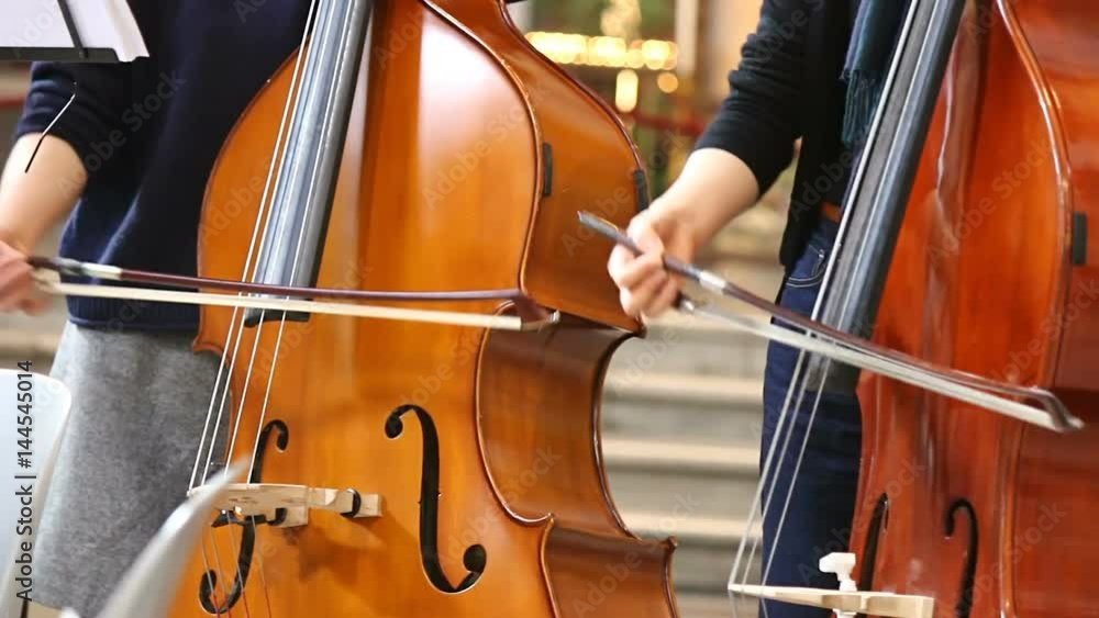 Close-up of musicians women playing classical music on cello. Close-up of musicians women playing classical music on cello.