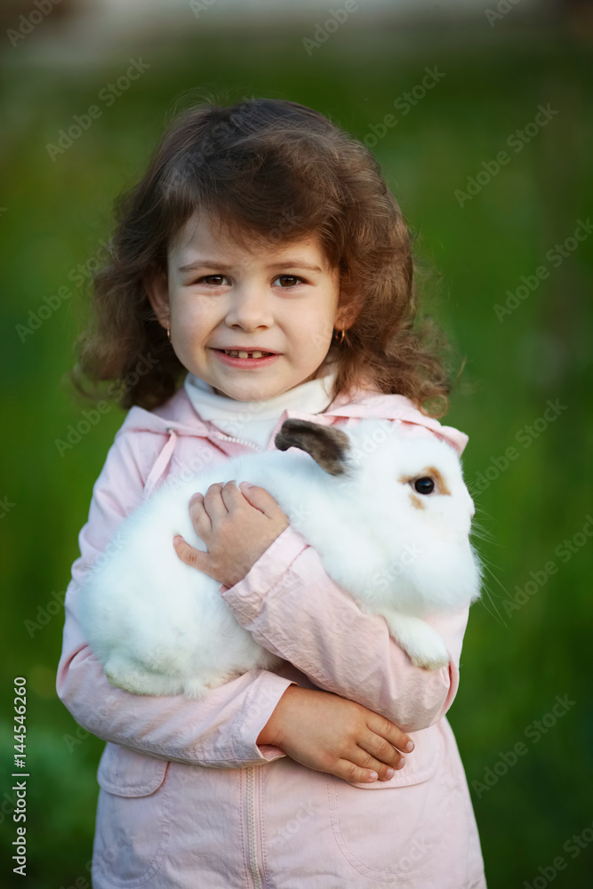 cute little girl with white rabbit cute little girl with white rabbit