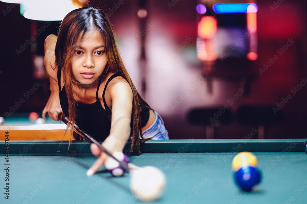 Premium Photo  Beautiful young girl came on a weekend to play billiards  for curiosity concept of a girl playing billiards