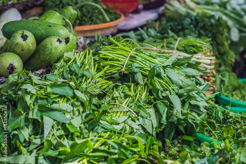Obraz premium Greenery in the Vietnamese market. Asian cuisine concept