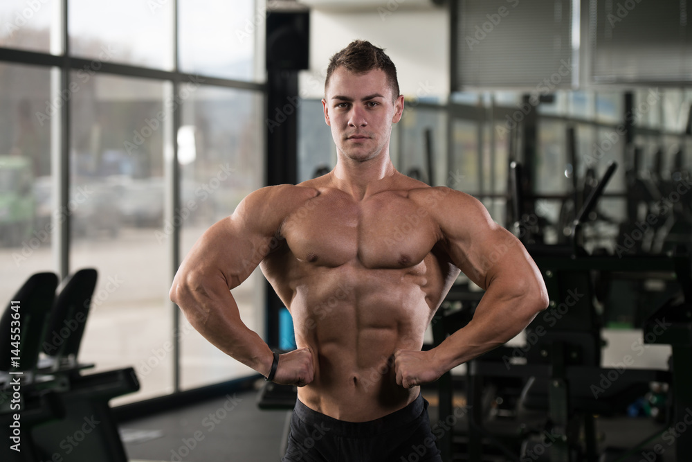 Serious Bodybuilder Standing In The Gym Serious Bodybuilder Standing In The Gym