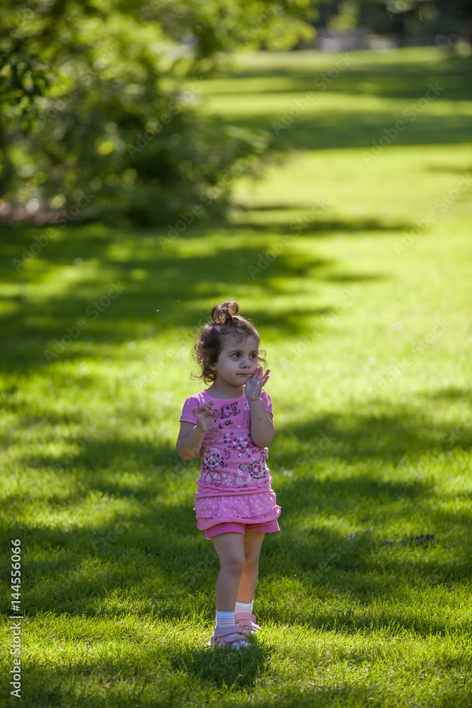 Little girl in the park Little girl in the park