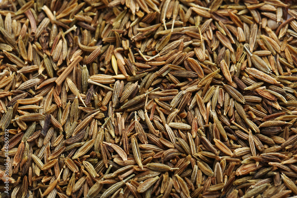 Pile of caraway seeds background Pile of caraway seeds background