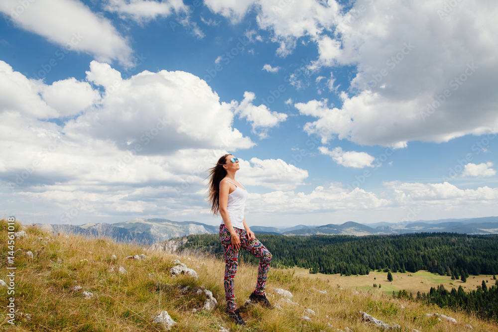 Naklejka premium woman with wind in hair in countryside