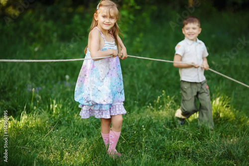 children pulling the rope outdoors