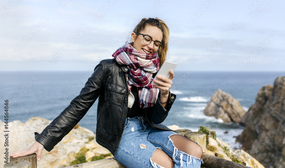 Young woman sending messages Young woman sending messages