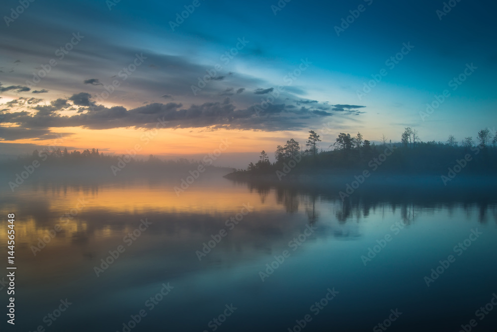 Early morning on the beach. Fog. Ladoga lake. Karelia. The Republic of Karelia.