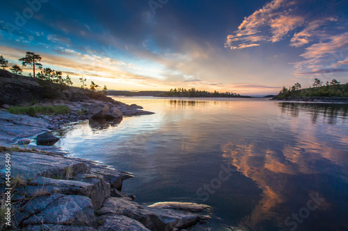 Sunrise over the water. Ladoga lake. Karelia. The Republic of Karelia.