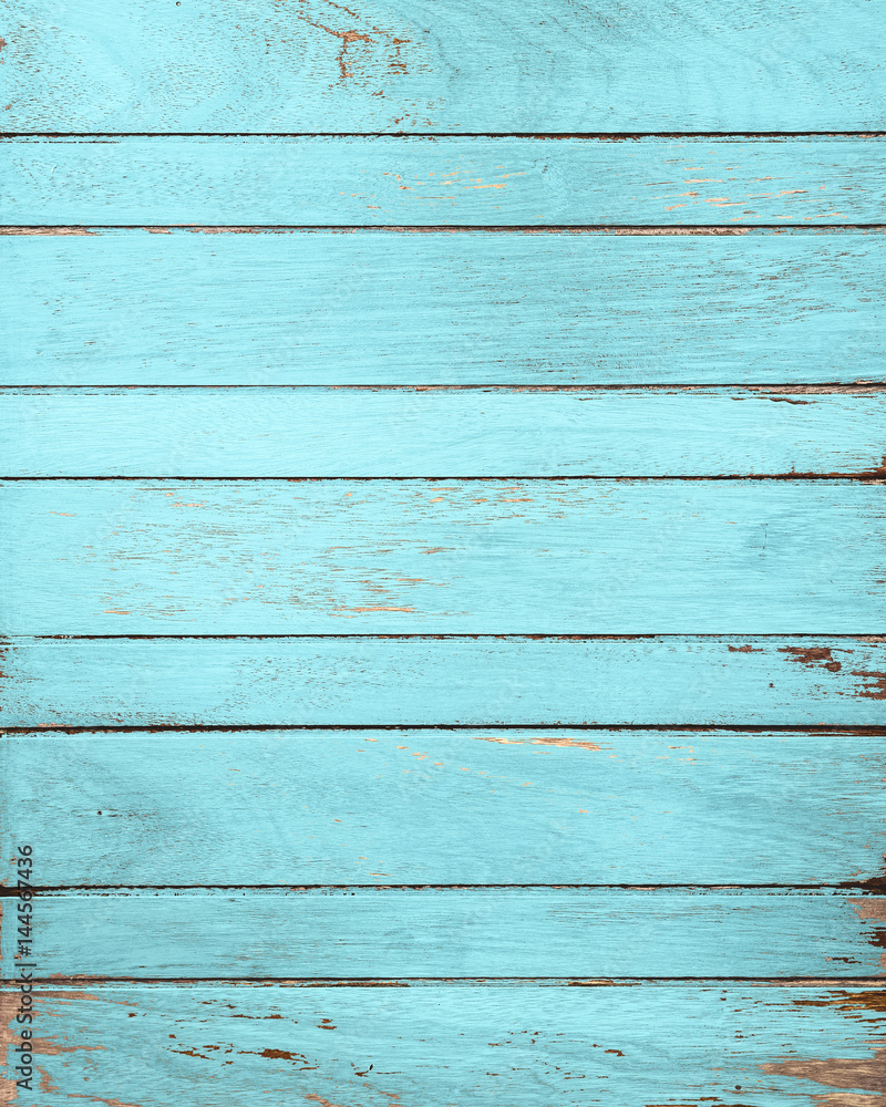 Naklejka premium Vintage blue wood background with peeling paint.