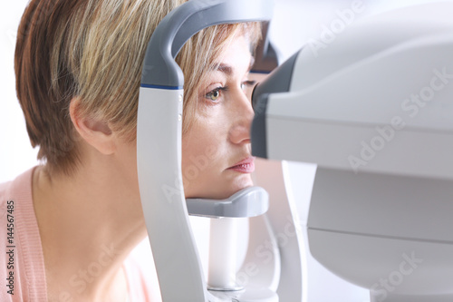 Cuadro en lienzo Measuring intraocular pressure of mature woman in clinic, closeup