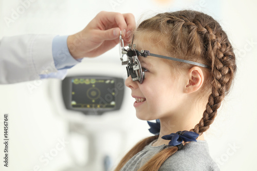 Ophthalmologist examining e...
