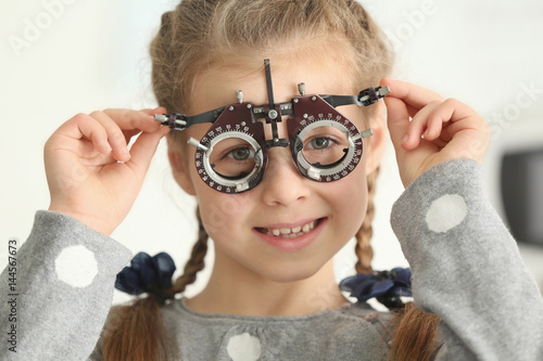 Cute little girl with trial...