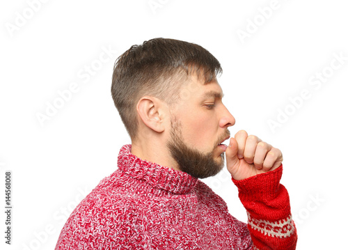 Young ill man on white back...