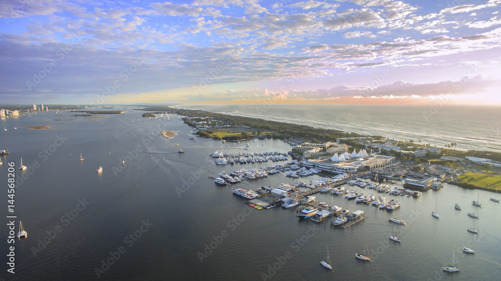 Aerial view over Marina Mirage and boats as the sunrise, Gold Coast