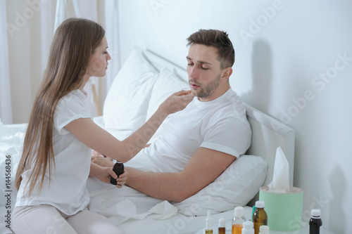 Young woman taking care of ...