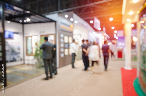 abstract blurred people in event hall for use as business background