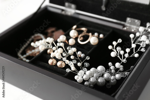 Collection of bijouterie in jewelry box © Africa Studio