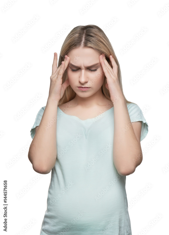 Young pregnant woman suffering from headache on white background Young pregnant woman suffering from headache on white background