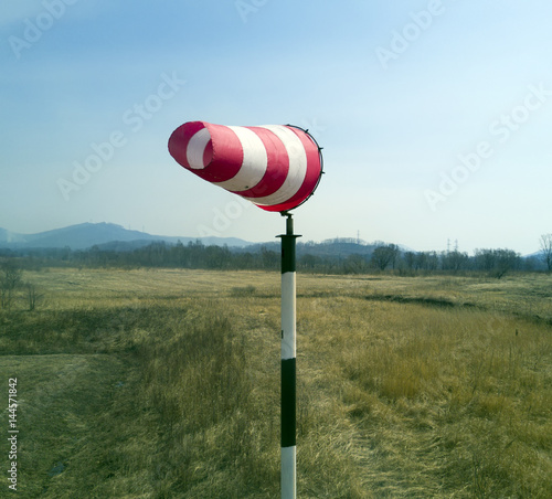 Red-white windsock indicating wind