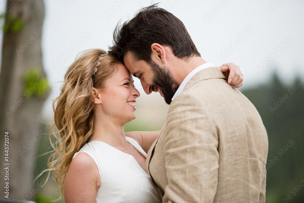 Bridge and Groom being romantic outdoors Bridge and Groom being romantic outdoors