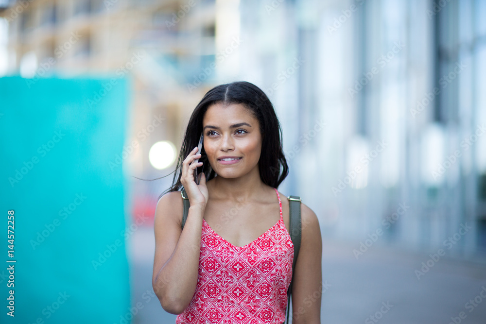 Young adult commuting and using smartphone Young adult commuting and using smartphone
