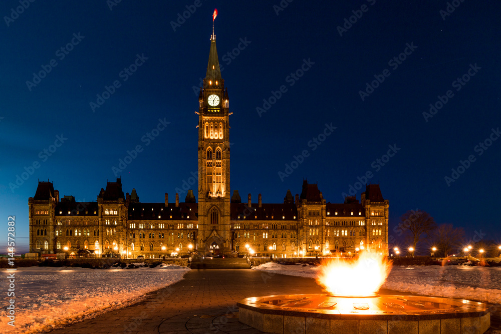 Parliament of Canada in Ottawa and Centennial Flame Winter