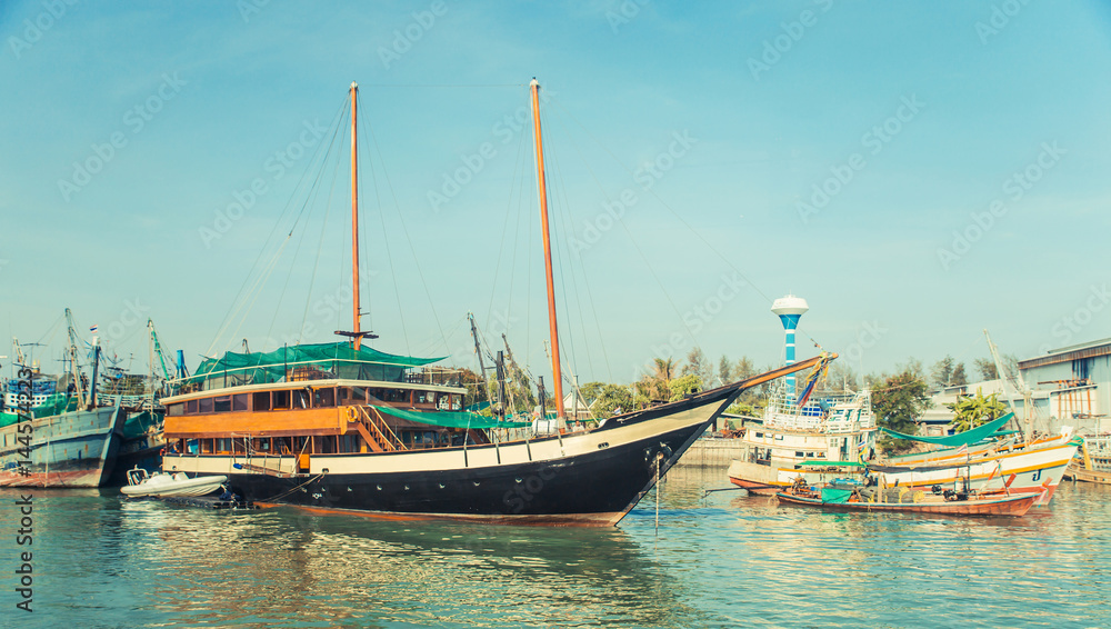 Old wreck Ship Harbor fishing and travel boat stranded. Thailand.