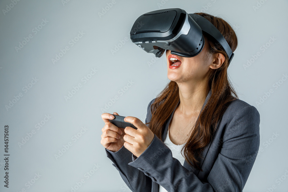 Woman wearing virtual reality goggles. Woman wearing virtual reality goggles.