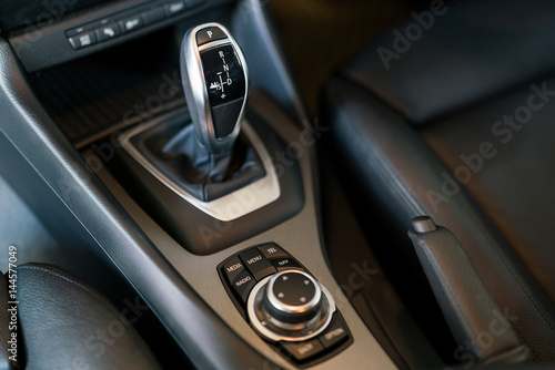 Detail of modern car interior, gear stick, automatic transmission in expensive car © KissShot