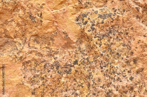 Beautiful old red stone wall texture background.