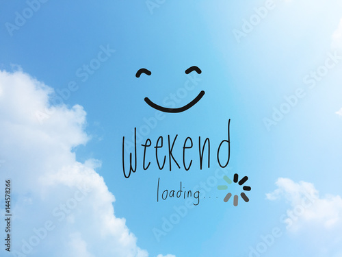Weekend loading word and smile face on blue sky