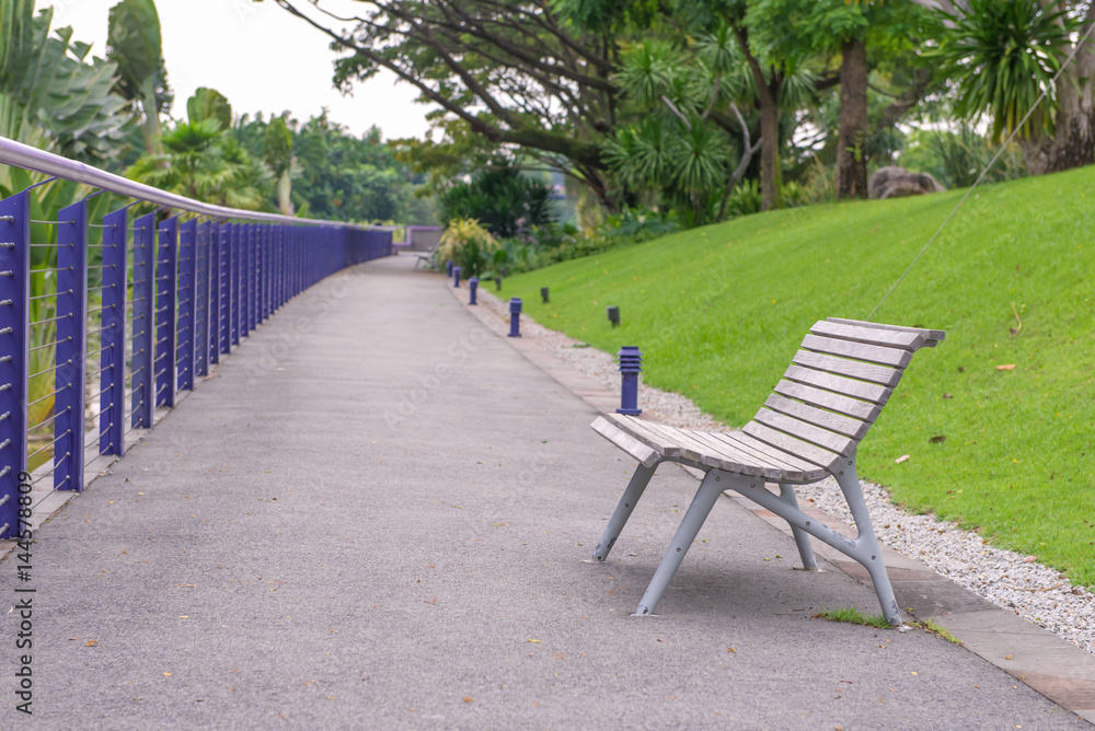 Benches in green grass at public park Benches in green grass at public park