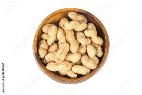 Dried peanuts in wooden bowl isolated on white background , top view.