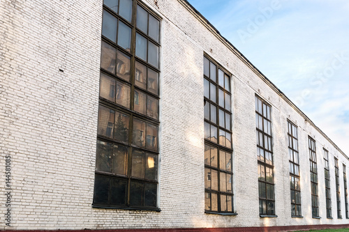 facade of an old industrial factory building. wide angle view.