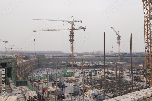 Wallpaper Mural 18 Dec,2014 Beijing. Work activity on a construction site in City with cranes and workers,building train station Torontodigital.ca