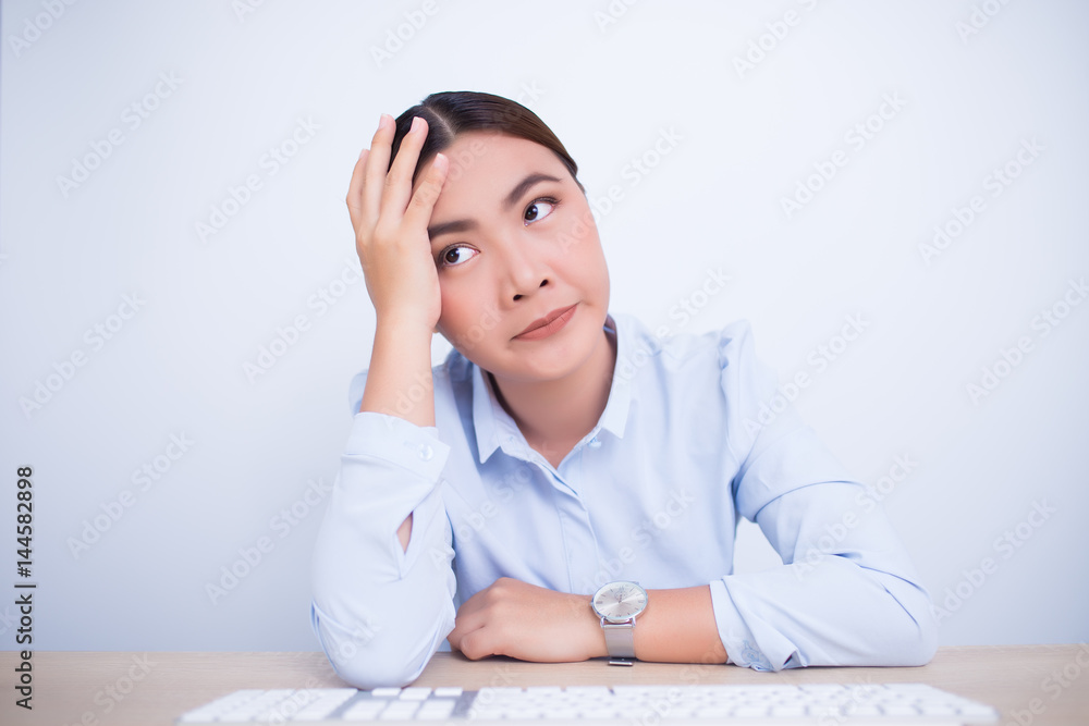 Woman use the computer and she feel boring Woman use the computer and she feel boring