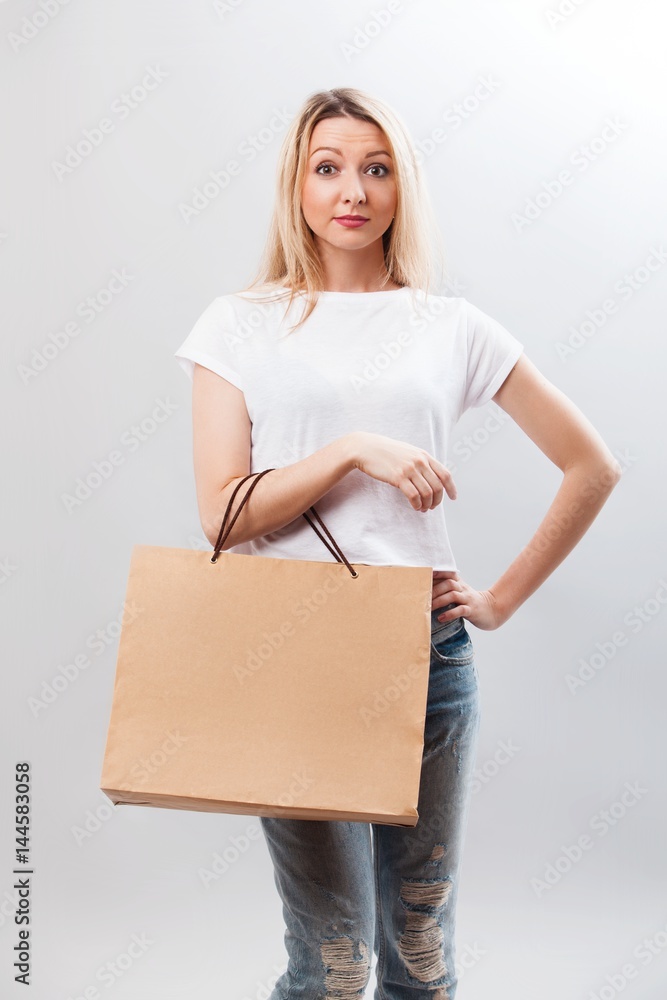 Portrait of pretty woman hold shopping bag. Female model isolated studio background. Portrait of pretty woman hold shopping bag. Female model isolated studio background.
