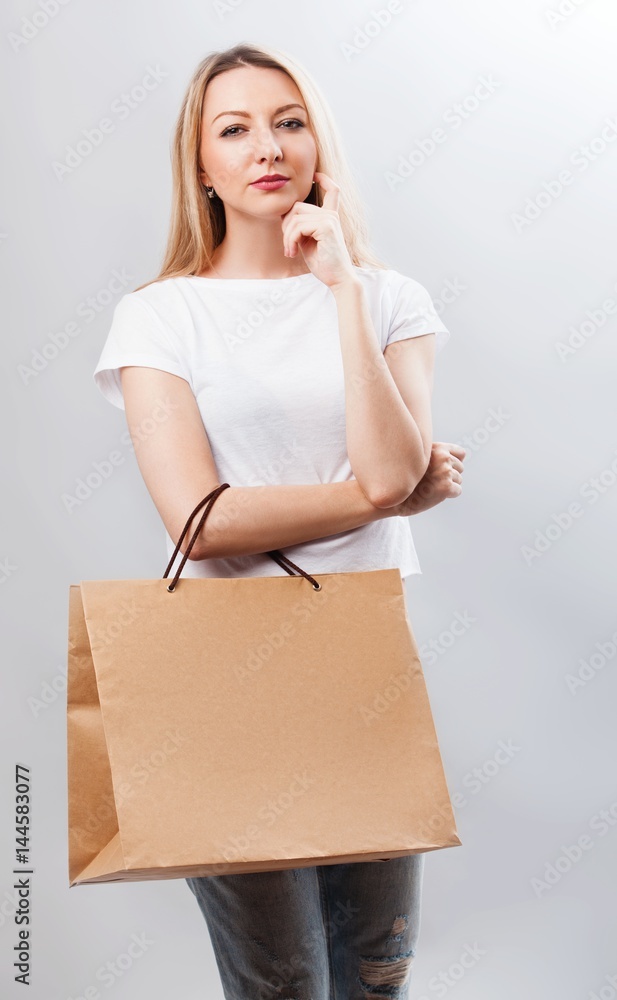 Portrait of pretty woman hold shopping bag. Female model isolated studio background. Portrait of pretty woman hold shopping bag. Female model isolated studio background.