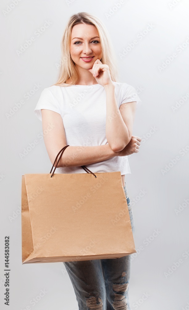 Portrait of pretty woman hold shopping bag. Female model isolated studio background. Portrait of pretty woman hold shopping bag. Female model isolated studio background.