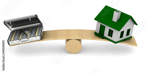 House and money on scales. ...