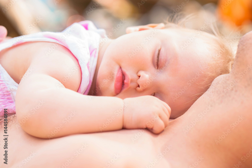 Father and baby. Baby lying on his father's chest. Father and baby. Baby lying on his father's chest.