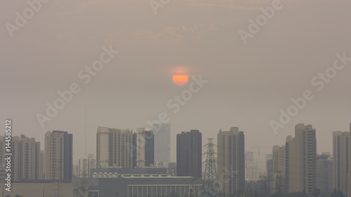 High angle horizontal building shot of sunset in beijing on a foggy day