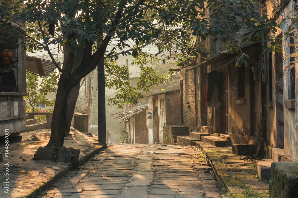 China,Chongqing : a traditional village and house Beside the famous travel attractions Ciqikou  city of ancient and historical shophouses,locals walking throught  old house