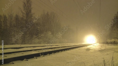 Passenger train on a snowy night