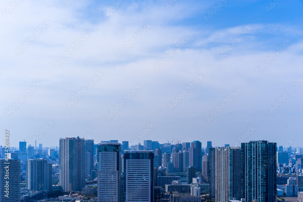 Aerial view of city against blue sky.  Tokyo.