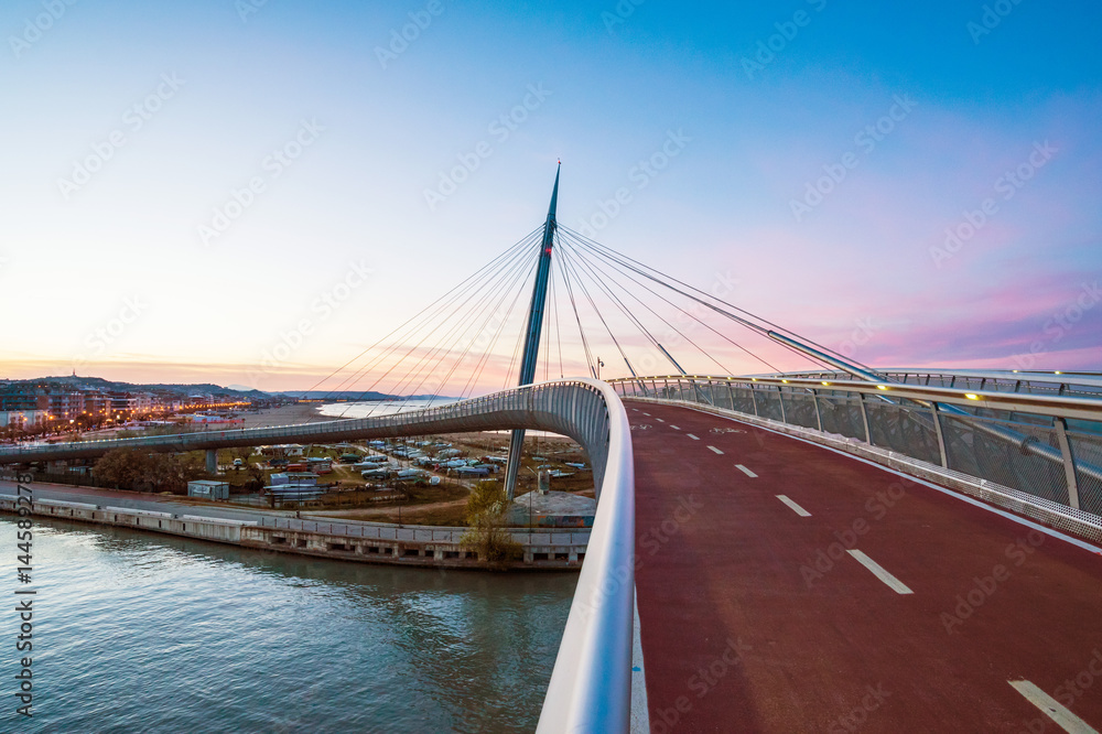 Pescara, Italy - The Ponte del Mare bridge at the dusk, in the canal and port of Pescara city, Abruzzo region
