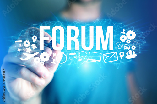 Concept of man holding futuristic interface with forum title and multimedia icons flying all around - Internet concept