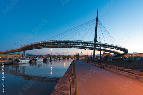 Pescara, Italy - The Ponte del Mare bridge at the dusk, in the canal and port of Pescara city, Abruzzo region © ValerioMei